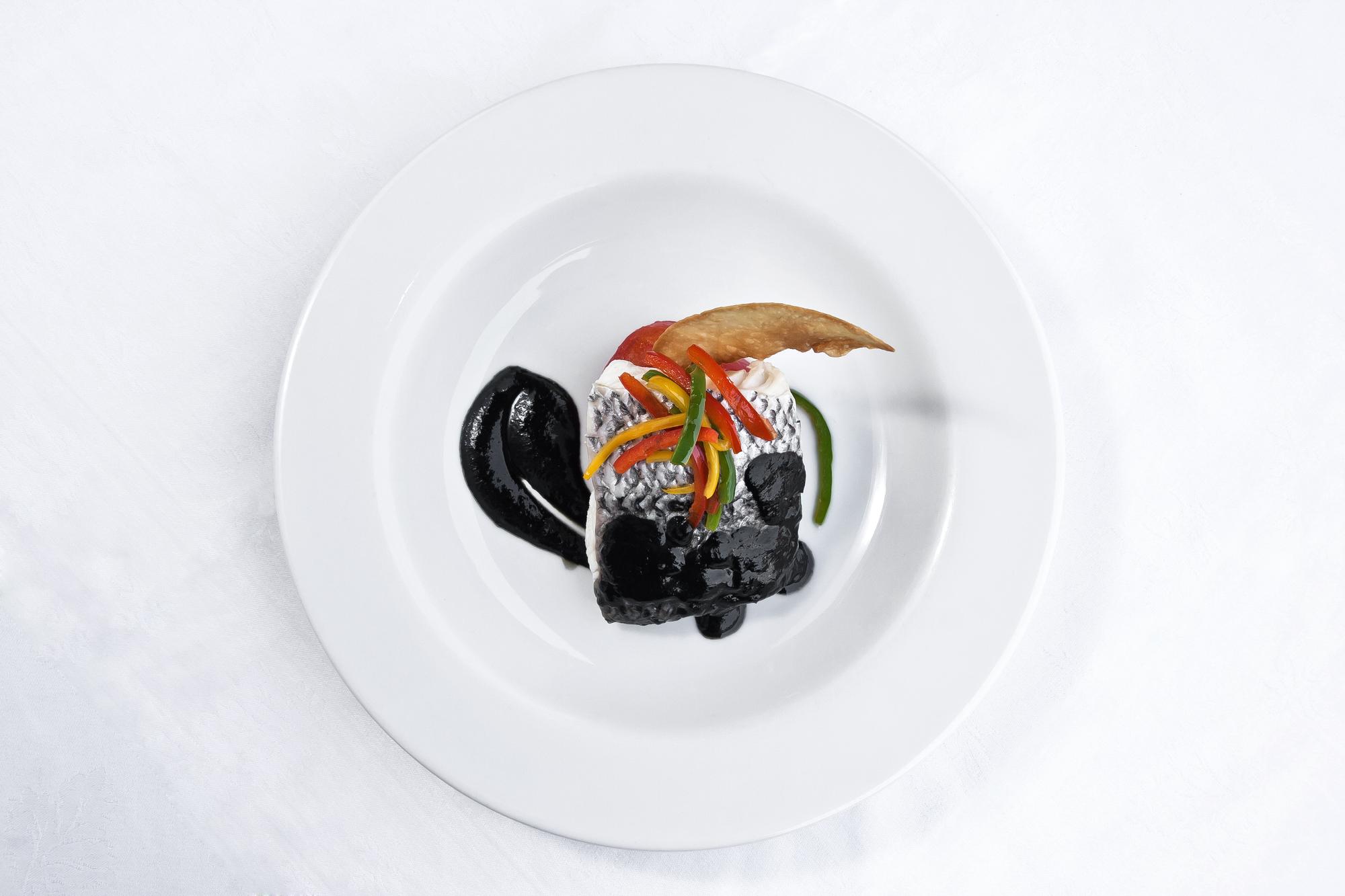Large editorial shot of plated tasting menu